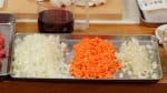 As for the vegetables, cut the onion, carrot and celery into 5mm (0.2") pieces. And chop the garlic clove into fine pieces.