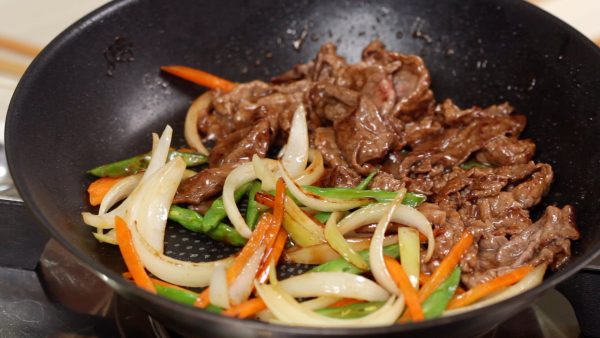 Distribute the sauce evenly but stir-fry the vegetables and the meat separately.