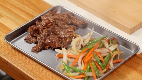 Remove and spread the ingredients onto a tray to cool quickly. This will help to keep the vegetables from getting soggy.