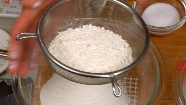 Let’s make the batter for the crepes. Sieve the cake flour into a bowl.