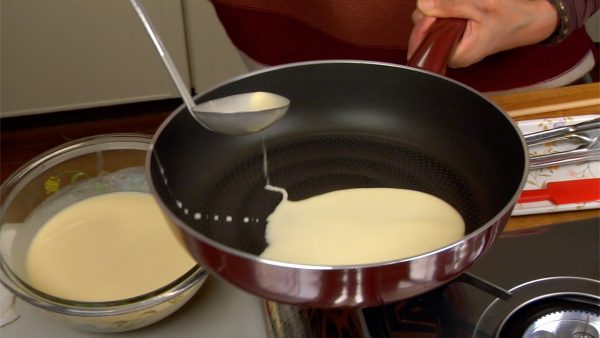 Ladle the batter onto the pan.