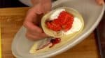 Lift the plate so as not to ruin the shape and roll the crepe downward, making a cone.