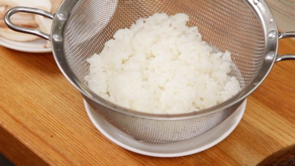 Strain the rice with a mesh strainer.