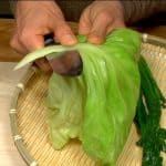 Remove the firm stalk of the cabbage leaf.