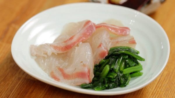 Place the spinach onto a plate and arrange the sea bream slices.