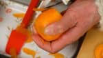 Remove the stem end of the carrot. Peel it with a peeler.