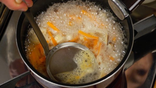 When it comes to a rolling boil, ladle out the foam to remove any unwanted flavor.