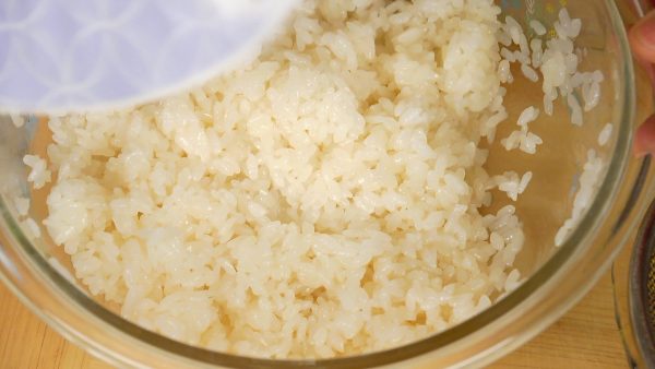 Use a fan to slightly cool the rice.