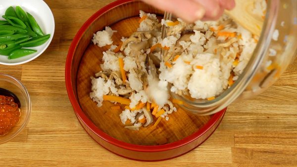 Now, place the rice into a wide shallow bowl.