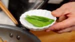 Remove the snow peas to keep them from discoloring.
