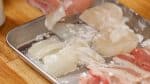 Then, add the potato starch and toss to coat. This will give the squid and scallop a pleasant texture and keep them from shrinking.