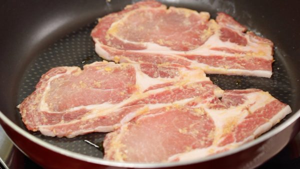 Then, place the pork slices onto the pan.