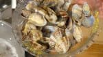 Remove the clams with tongs as soon as the shells are open. This will help to avoid overcooking.