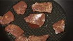 Arrange the marinated liver pieces on the heated pan. Occasionally shake the pan to help them brown evenly.