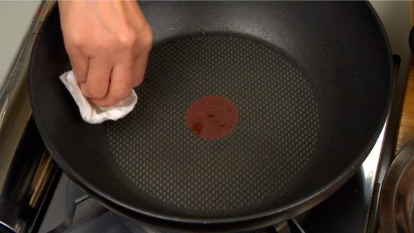 Turn off the burner and clean the pan with a paper towel.