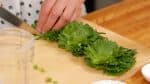 First, let’s make the Japanese-inspired pesto sauce. Remove the stem ends of the shiso leaves.