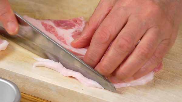 Next, trim off the excess fat from the pork loin slices.