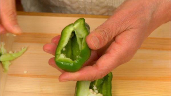 Cut the bell pepper in half lengthwise. Remove the stem and the seeds.