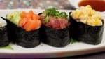 Enjoy the gunkanmaki before the nori gets soggy and the toppings fall off.