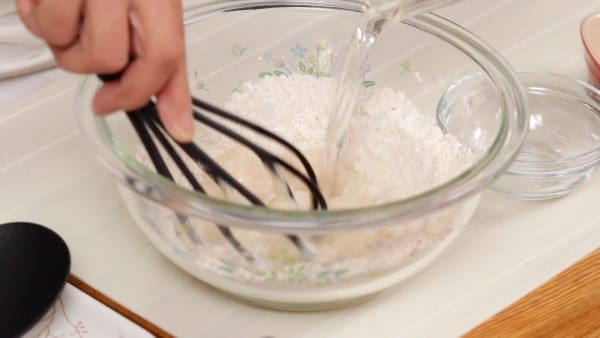 Add 100 ml (3.4 fl oz) of water while stirring.