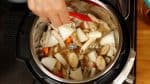 Submerge the dashi pack in the broth. A dashi pack usually contains coarsely ground real bonito flakes and kombu seaweed, and you can make authentic dashi stock quickly.