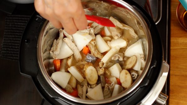 Submerge the dashi pack in the broth. A dashi pack usually contains coarsely ground real bonito flakes and kombu seaweed, and you can make authentic dashi stock quickly.