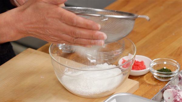 Sieve the powder into a bowl of cold water.