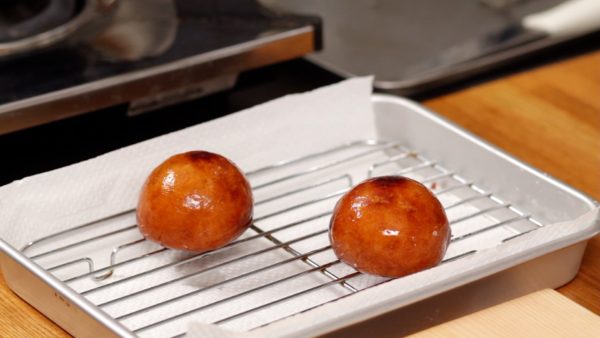 Place the fried manju onto a cooling rack.