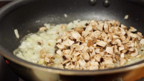 Add the chopped button mushrooms.