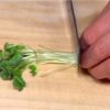 Cut the kaiware radish sprouts in half and remove the root parts.