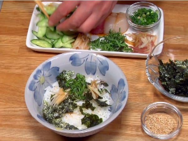 Add the white sesame seeds, toasted nori seaweed, myoga ginger bud, shiso leaves and ginger root.