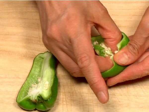 Cut the bell pepper in half. Remove the seeds from the inside.