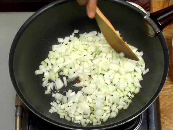 Add the coarsely chopped onion and stir-fry it for 5 minutes on high heat.