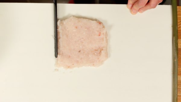 Shape it into a rectangle. This chikuwa is relatively thick and it’ll be about 10cm (3.9") long. Make sure that the surimi has an even thickness.