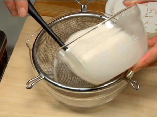 Strain the mixture into a bowl using a mesh strainer.
