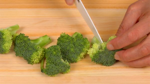 Cut the broccoli into bite-size pieces.