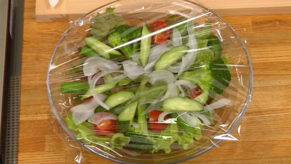 Cover the salad bowl with a plastic wrap and let it chill in the fridge.