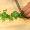 Cut the mitsuba parsley in half. Chop it into 3 cm (1.2") pieces.
