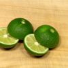 Cut the sudachi, a type of Japanese green citrus, in half.