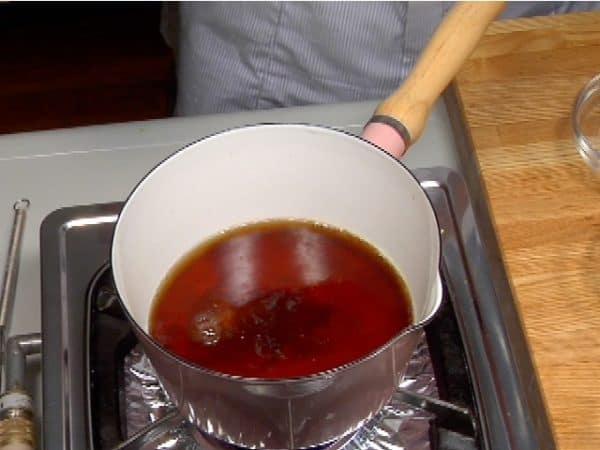 When it reaches a full boil, add the soy sauce and granulated dashi stock powder.