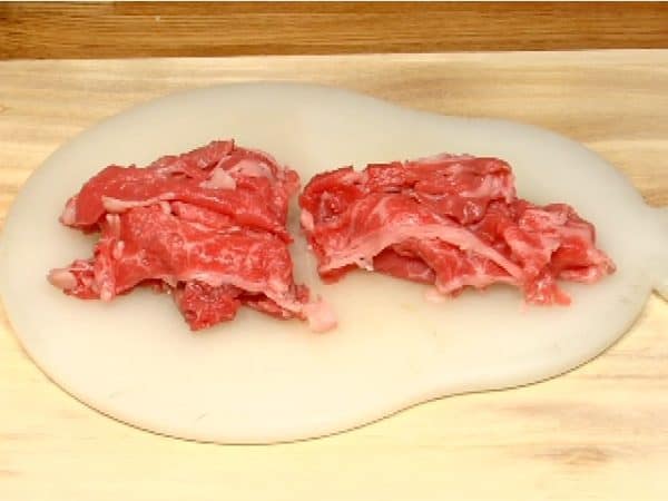 Cut the beef slices in half.