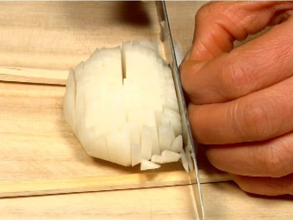 Rotate the turnip by 90 degrees and thinly slice it perpendicular to the initial cuts.