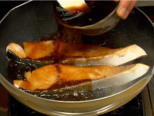 Pour over the teriyaki sauce. The sauce contains a relatively large amount of alcohol so be careful not to ignite it.
