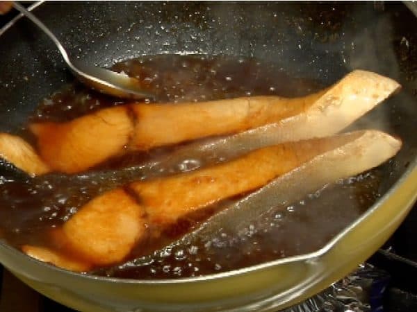 Reduce the sauce on medium heat. Spoon the sauce over the fish 2 to 3 times while cooking.