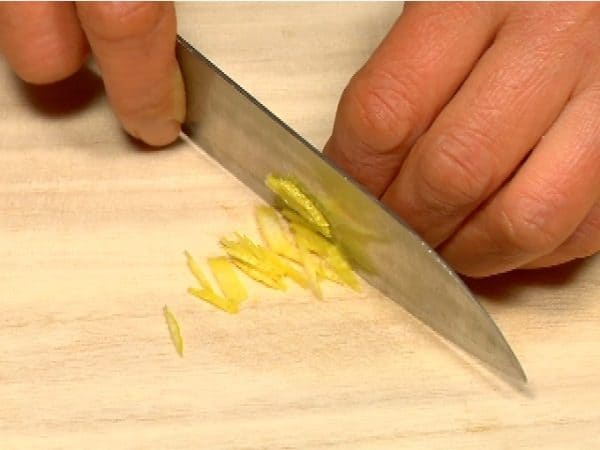 Cut the yuzu zest into thin strips.