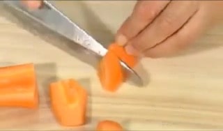 Cut the carrot into smaller pieces as well.