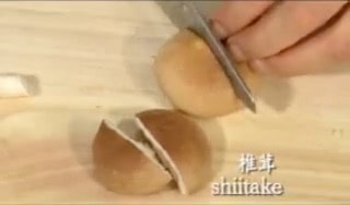 Remove the stem of shiitake mushrooms and cut the caps in half.