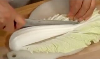 Cut out the firm white part from the napa cabbage leaves.