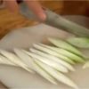 Slice the long green onion also known as naganegi using diagonal cuts.