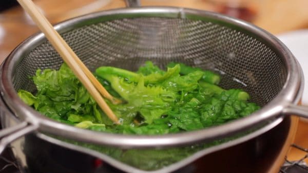 Then, add the leafy part and boil for a little less than 1 more minute. The stalk can be firm so the best way to test it is to actually bite it.